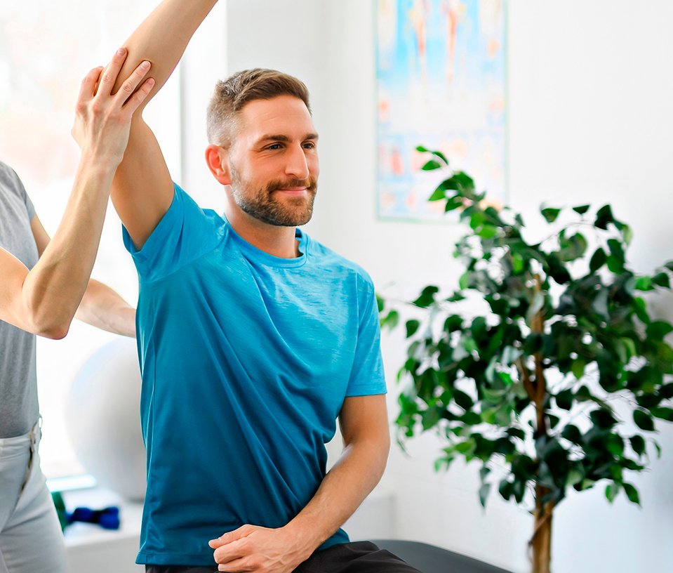 man having a chiropractic adjustment - Chiropractor in Buford, GA